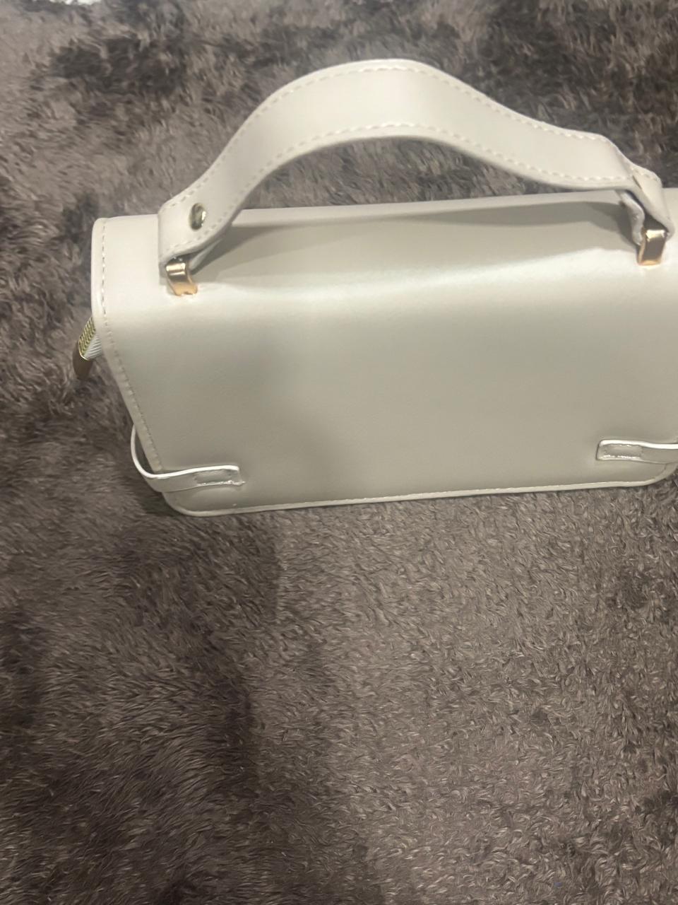 Stylish white leather purse with sling belt