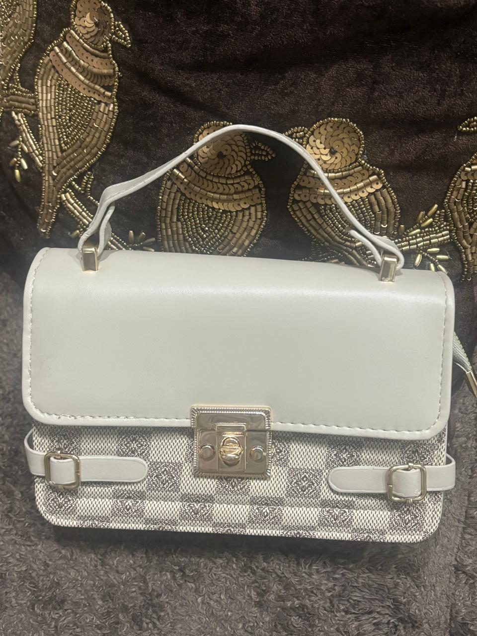 Stylish white leather purse with sling belt